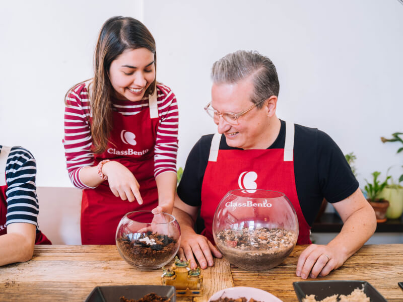 A daughter and her father trying terrarium making to unwind together
